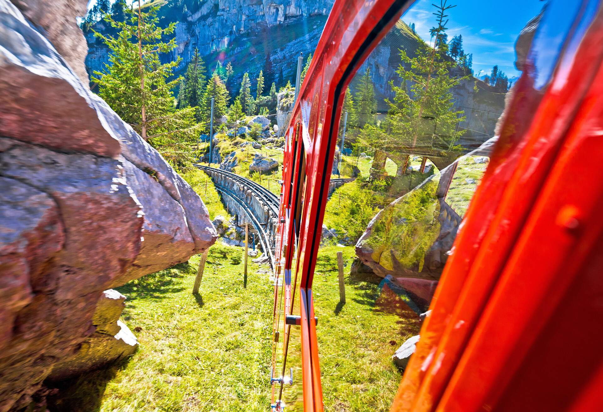 View of Mount Pilatus descent from worlds steepest cogwheel railway Pilatusbahn, tourist landscape of Switzerland