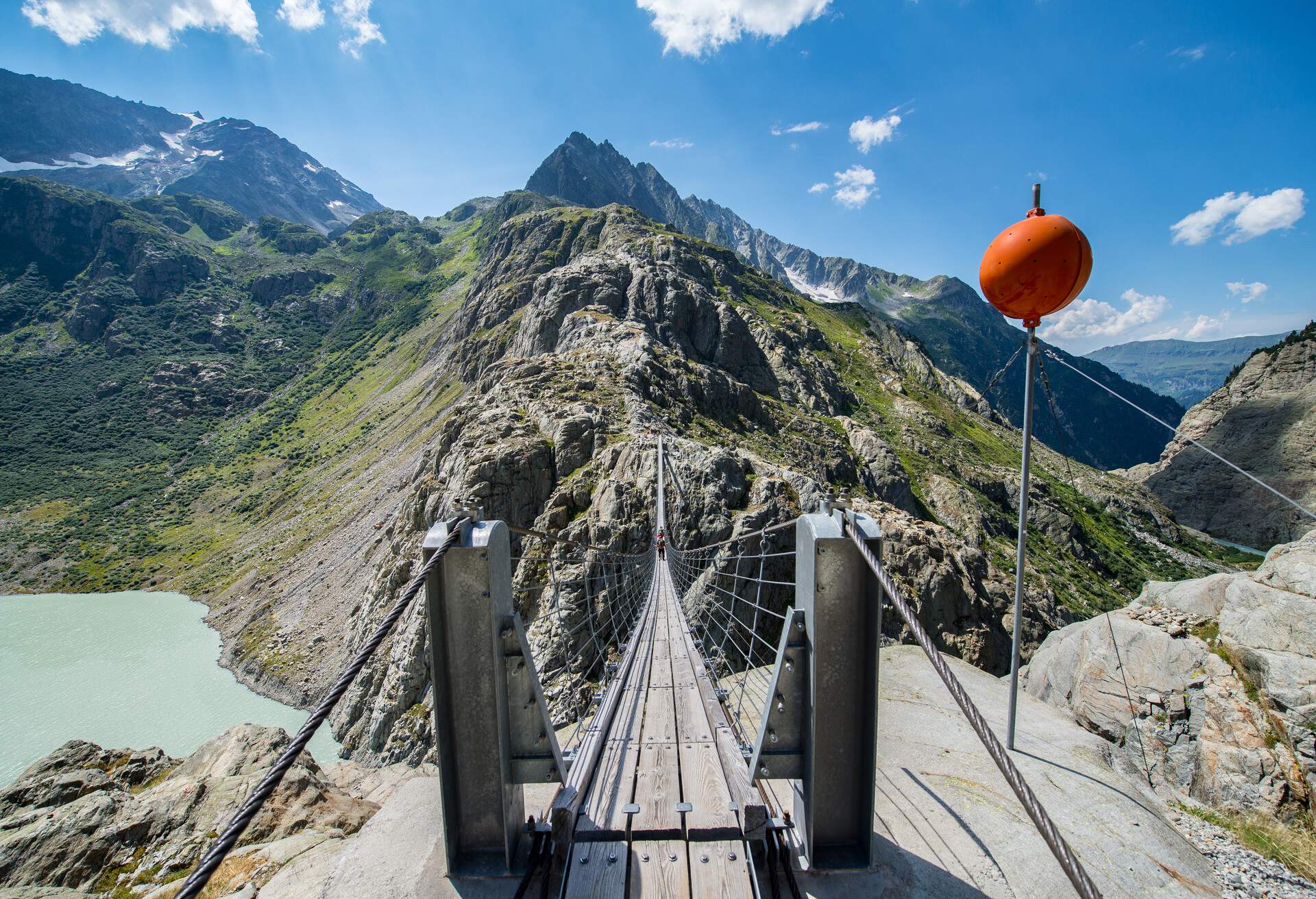 The Trift brige (Triftbrücke in German) is probably the longest and highest suspension bridge in the alps in a rural landscapeIt is a turist attraction and can only be reached by walking. The bridge passes a lake with was a glacier some years ago. Due to global warming the glacier is melting and gets shorter from year to year.