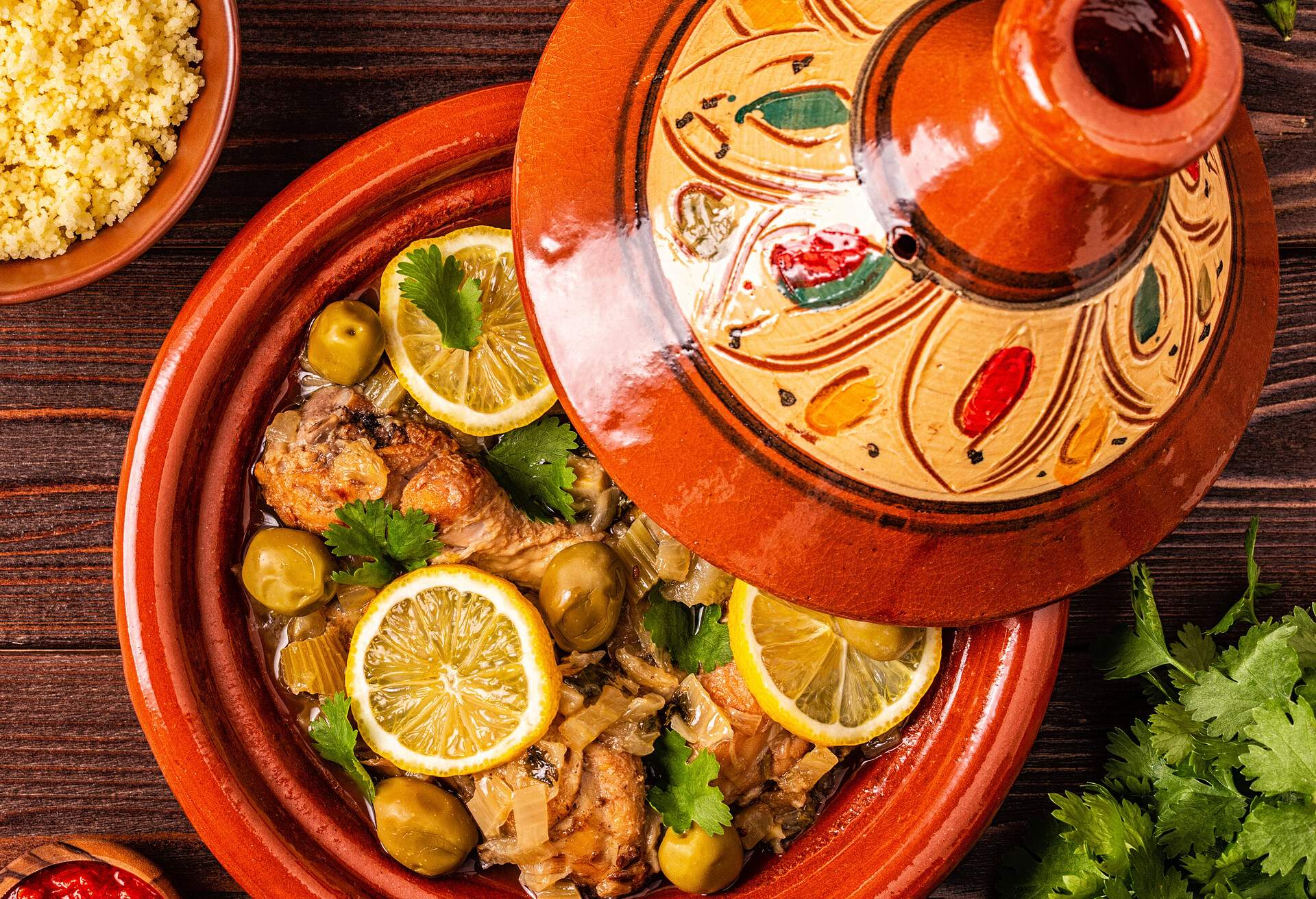 Traditional moroccan tajine of chicken with salted lemons, olives. Top view.