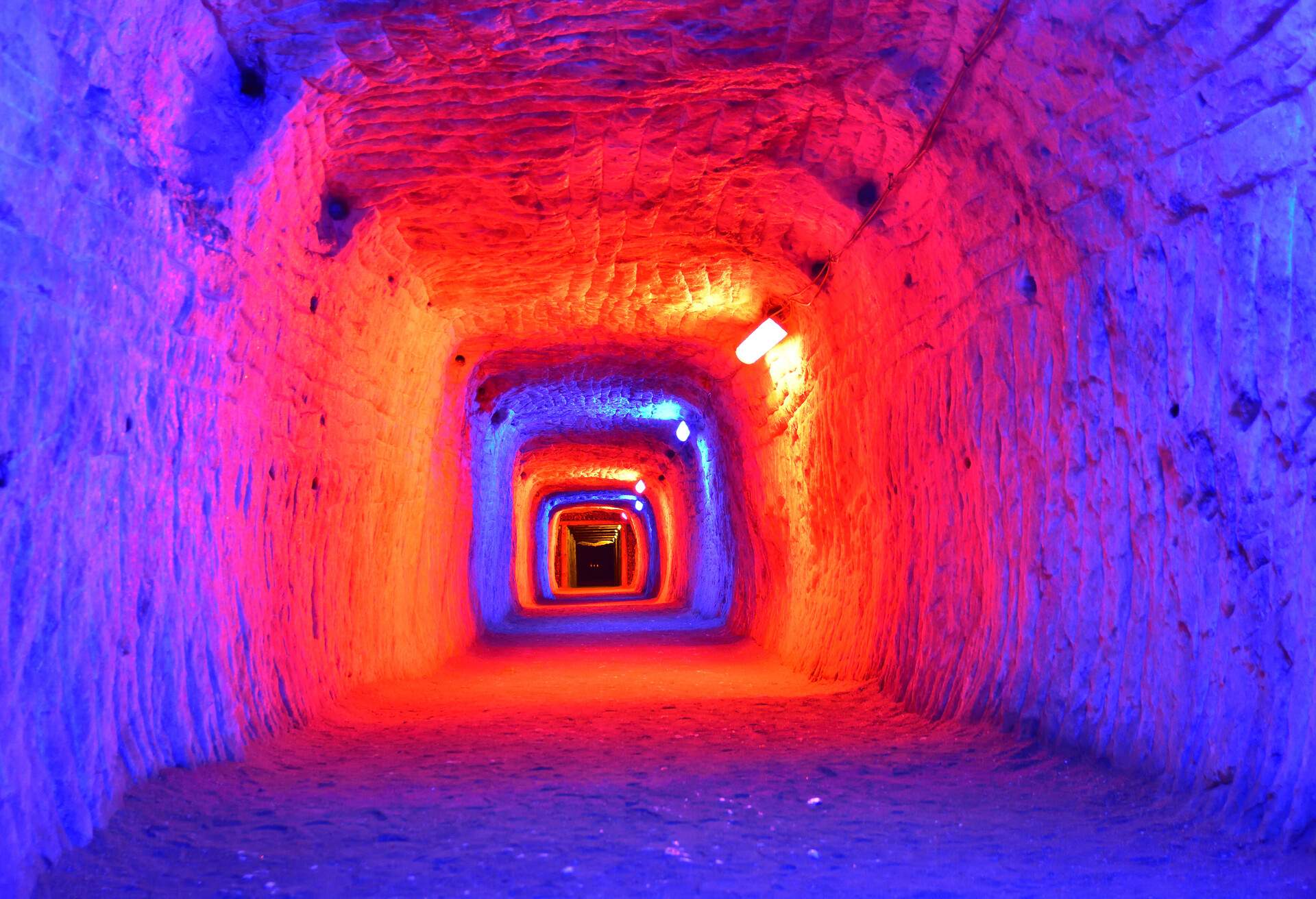 Highlighted with colour lamps underground salt mine working
