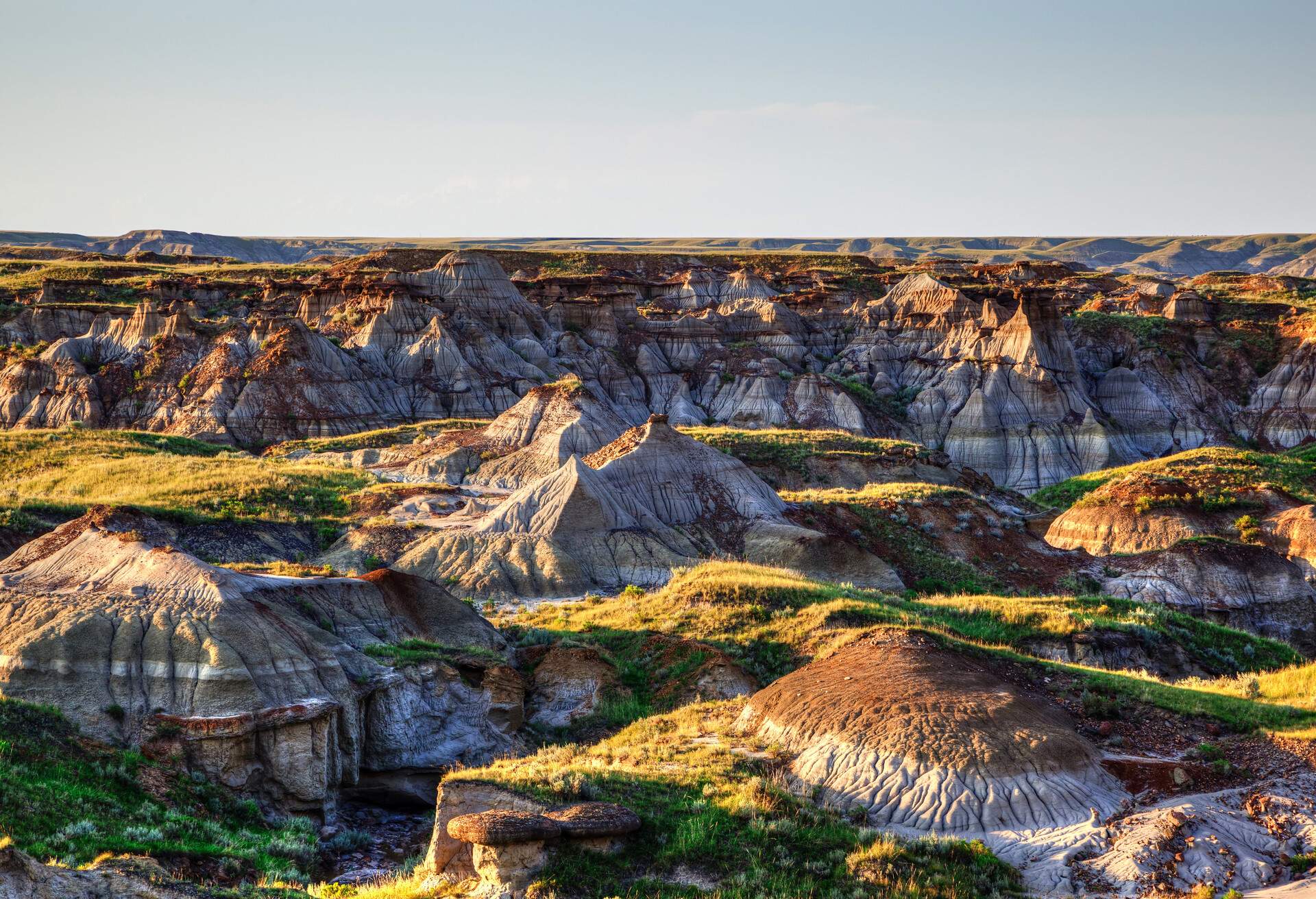 Sun setting over Dinosaur Provincial Park, a UNESCO World Heritage Site in Alberta, Canada. The Alberta badlands is well known for being one of the richest dinosaur fossil locales in the world.