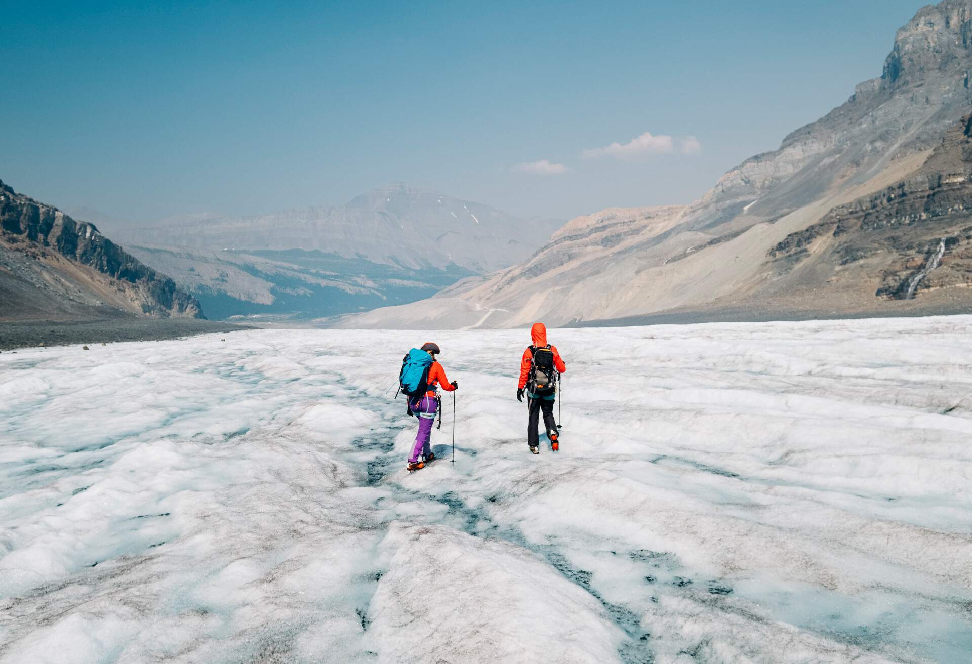 Lake Louise, AB , CAN - July , 19, 2021: Two female mountain climbers walks down the bare ice of the long Athabasca Glacier in Jasper National Park on July 19th, 2021. On her back is a large backpack..(Photo by Alex Ratson via Getty Images)