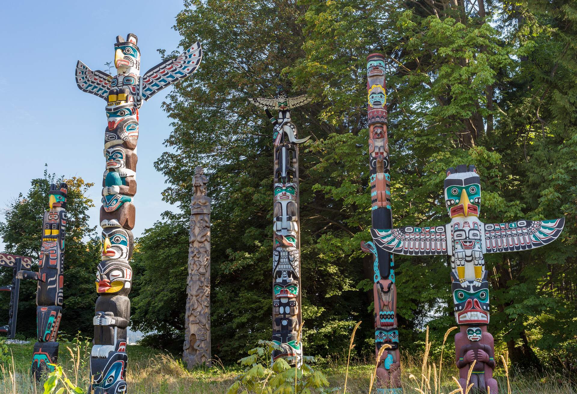 Part of the totem poles displayed at Brockton Point, Stanley Park, Vancouver, BC. These totem poles are pieces of BC First Nations artistry. Four of the original totems were from Alert Bay on Vancouver Island; additional pieces were from the Queen Charlotte Islands and rivers Inlet on the central coast of BC.Because many of the original totems were carved as early as the 1880s, they have been sent to museums for preservation. The totems at Brockton Point are new ones commissioned or loaned to the park between 1986 and 1992.