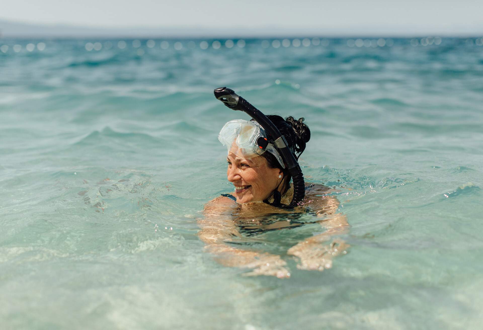 THEME_SNORKELLING_PEOPLE_SENIOR_WOMAN_GettyImages-1162315267