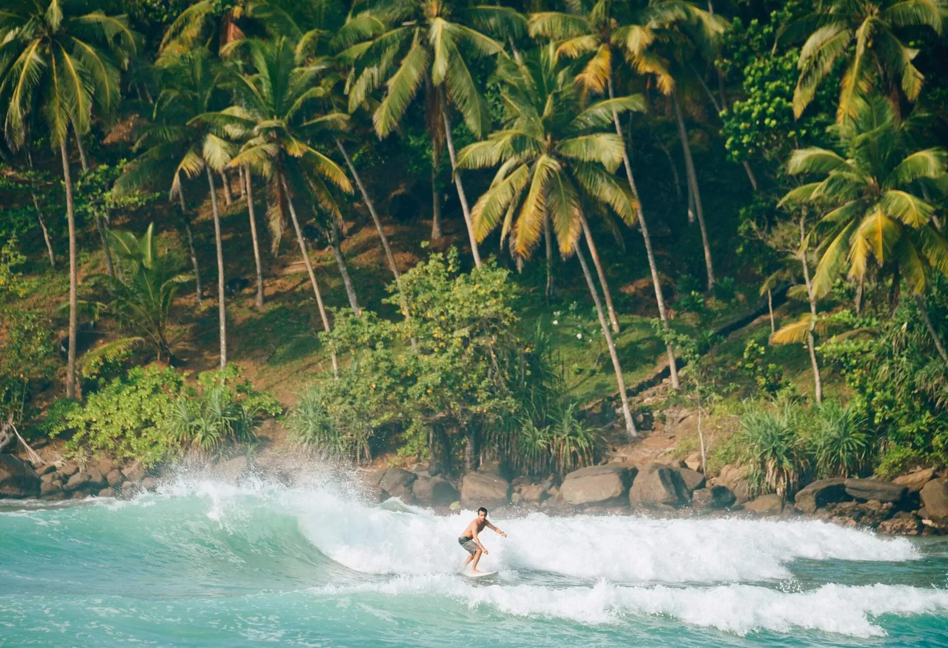 Surfers at Mirissa beach in Sri Lanka