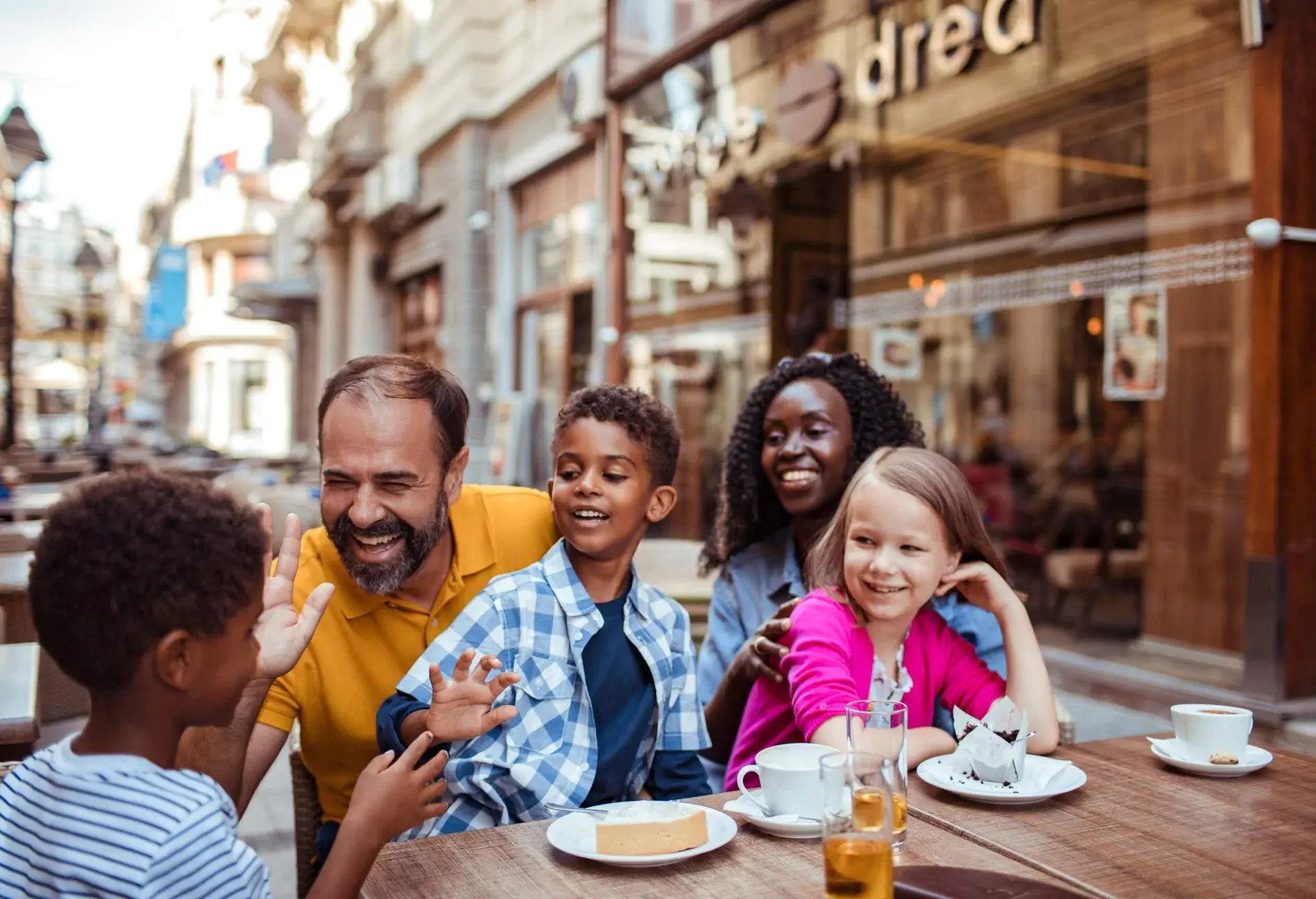 Close up of a young family enjoying time together in a cafe
