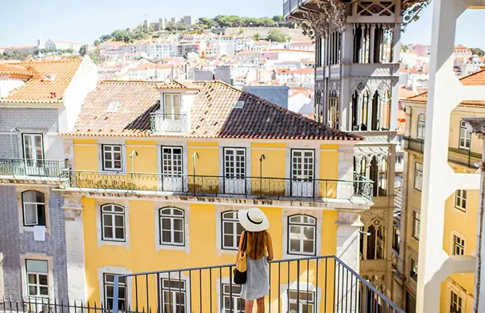 View on the old buildings with famous saint Justa metal lift during the sunny weather in Lisbon city, Portugal; Shutterstock ID 763020433; Purpose: Content; Brand (KAYAK, Momondo, Any): Momondo