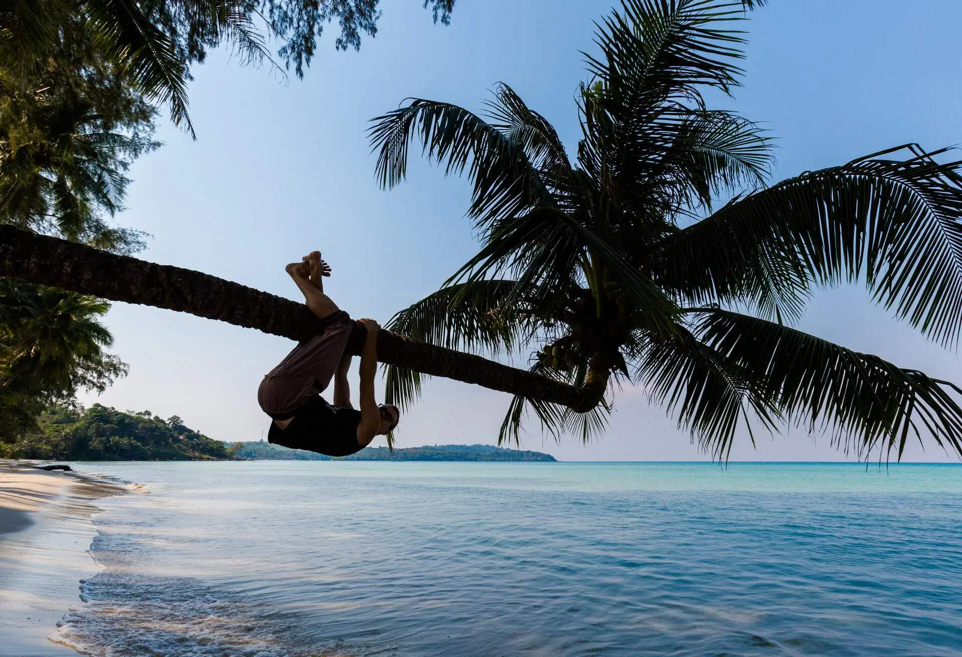 Summer landscape on tropical koh Kood island in Thailand. Beautiful young caucasian couple on panorama of white sand beach with coconut palms taken on Klong Chao.; Shutterstock ID 751976884; Purpose: SWOODOO; Brand (KAYAK, Momondo, Any): Any