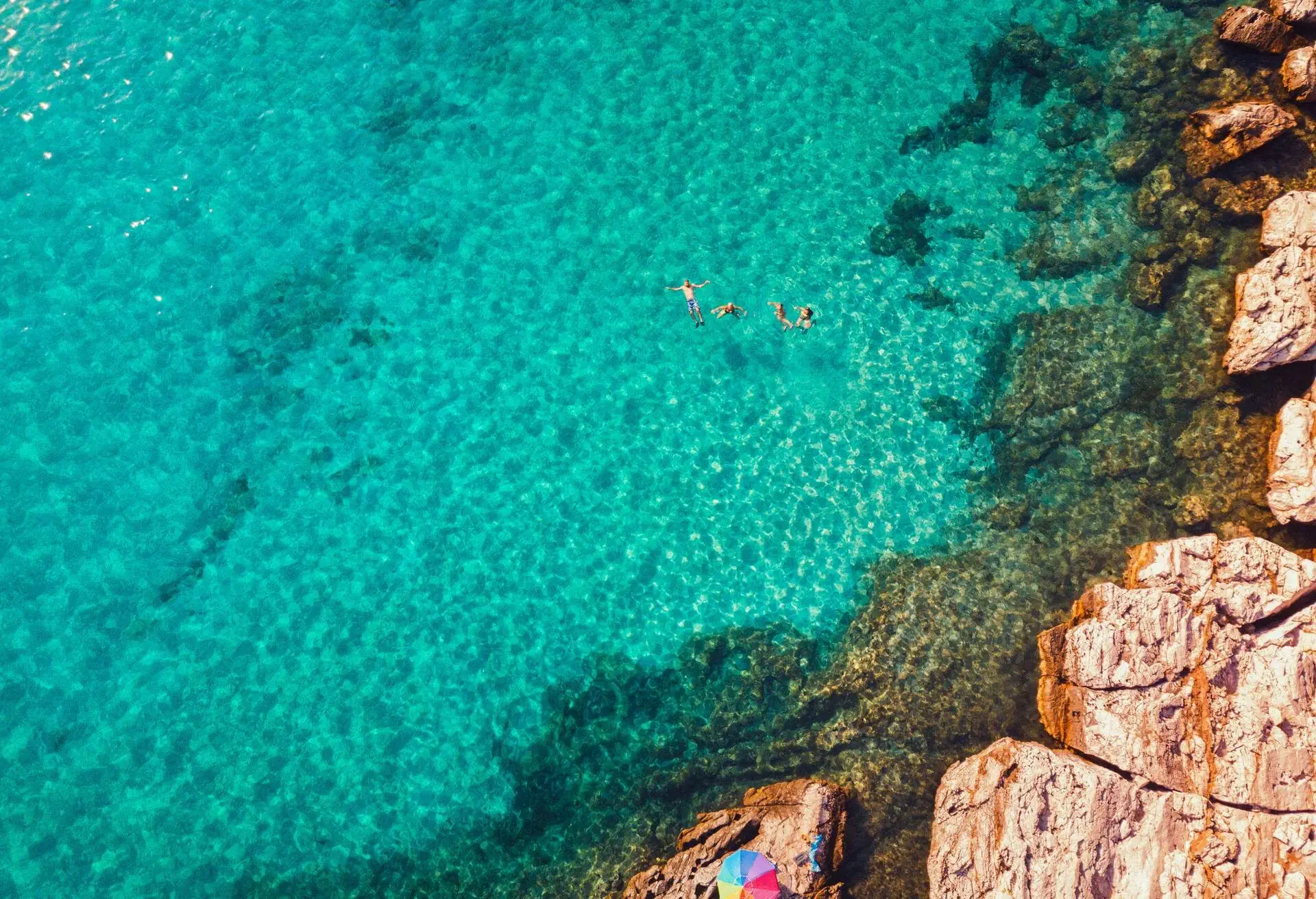 DEST_GREECE_THASOS_THEME_NATURE_BEACH_PEOPLE_FAMILY_SWIMMING_GettyImages-1318891857.jpg