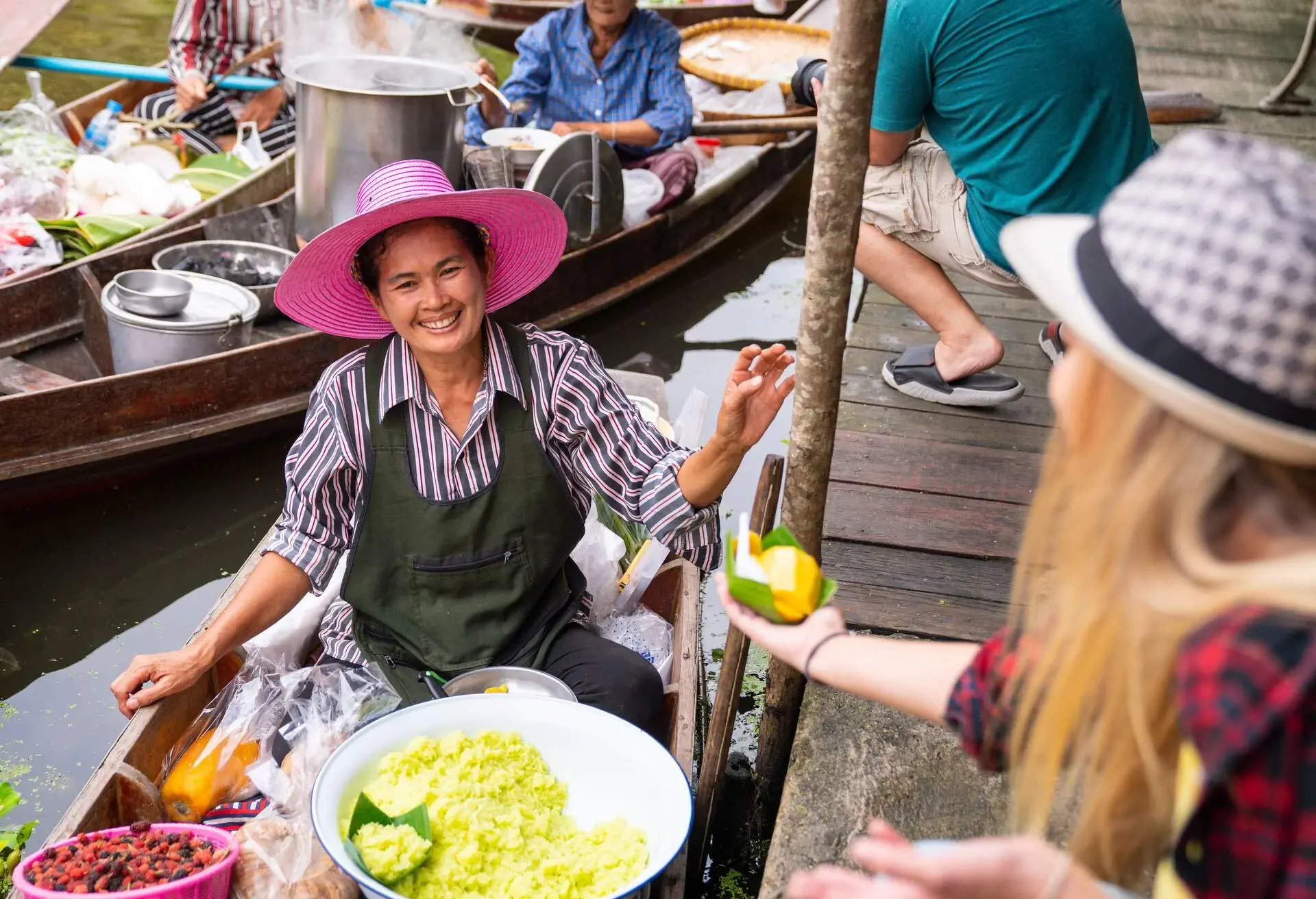 DEST_THAILAND_BANGKOK_VENDOR_PADDLING_BOAT_FRUIT_GettyImages-1335029685
