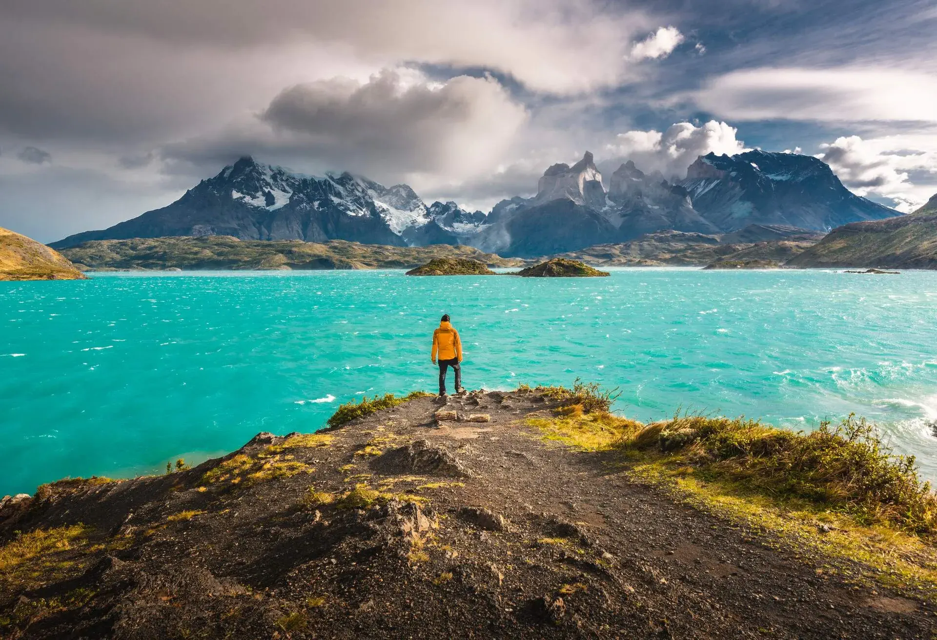 DEST_CHILE_MAGALLANES_TORRES-DEL-PAINE-NATIONAL-PARK_MAN_PERSON_LAKE_MOUNTAINS_GettyImages-1154755689
