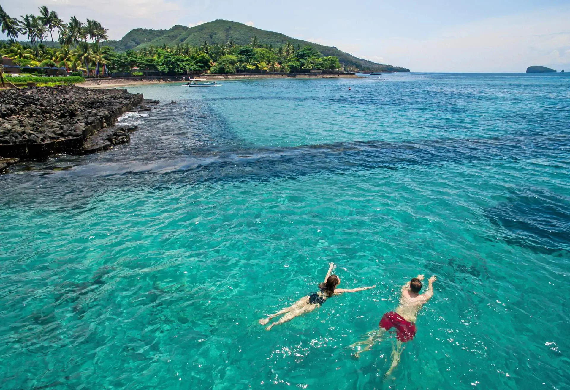 Aerial photo from above of beautiful young couple swimming in the ocean at the tropical island beach; Shutterstock ID 403008676