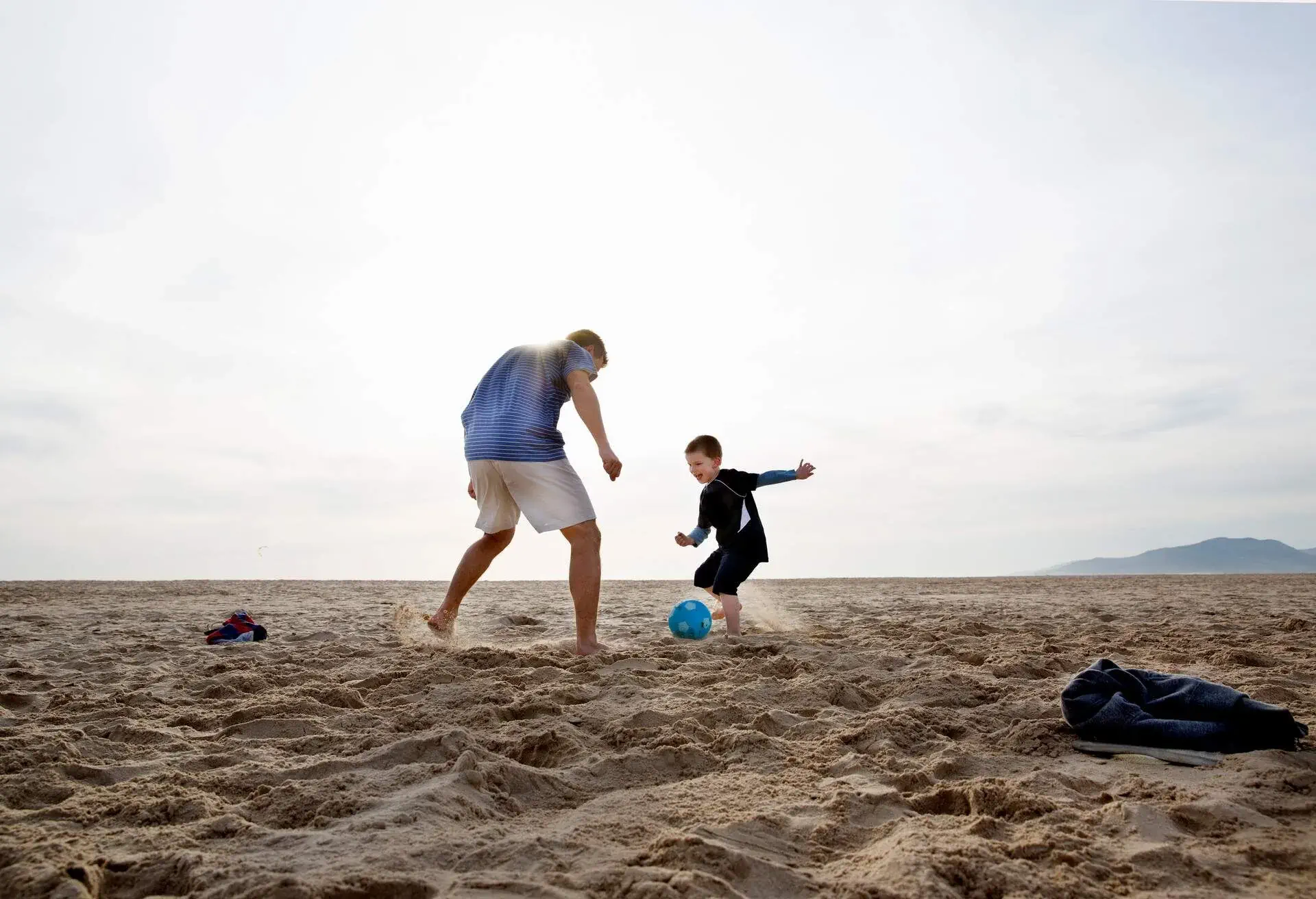 DEST_SPAIN_ANDALUCIA_THEME_PEOPLE_KID_BOY_MAN_FOOTBALL_BEACH_GettyImages-168199018