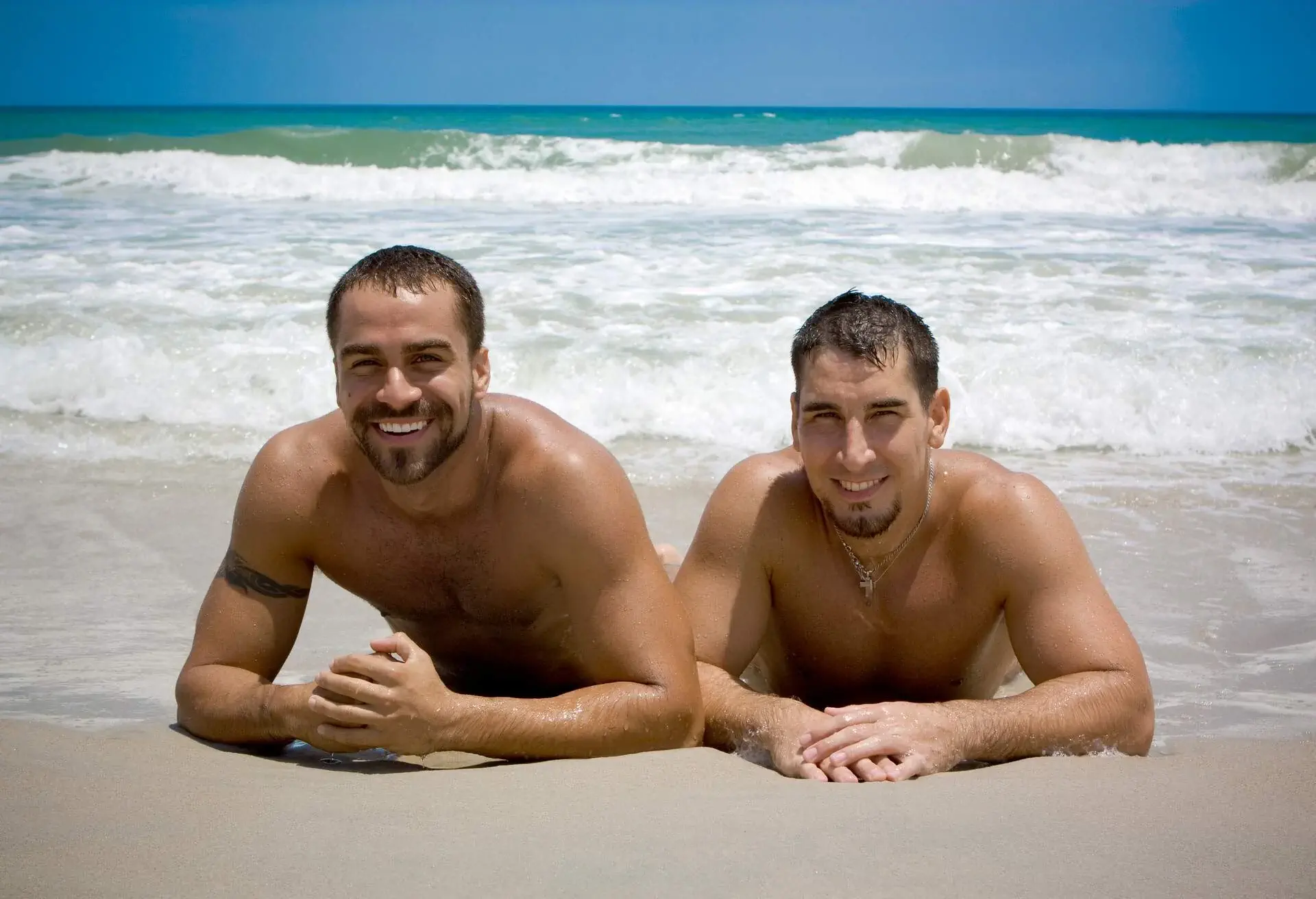 THEME_NATURIST_NUDIST_BEACH_PEOPLE_LGBTQ_COUPLE_GettyImages-146756322