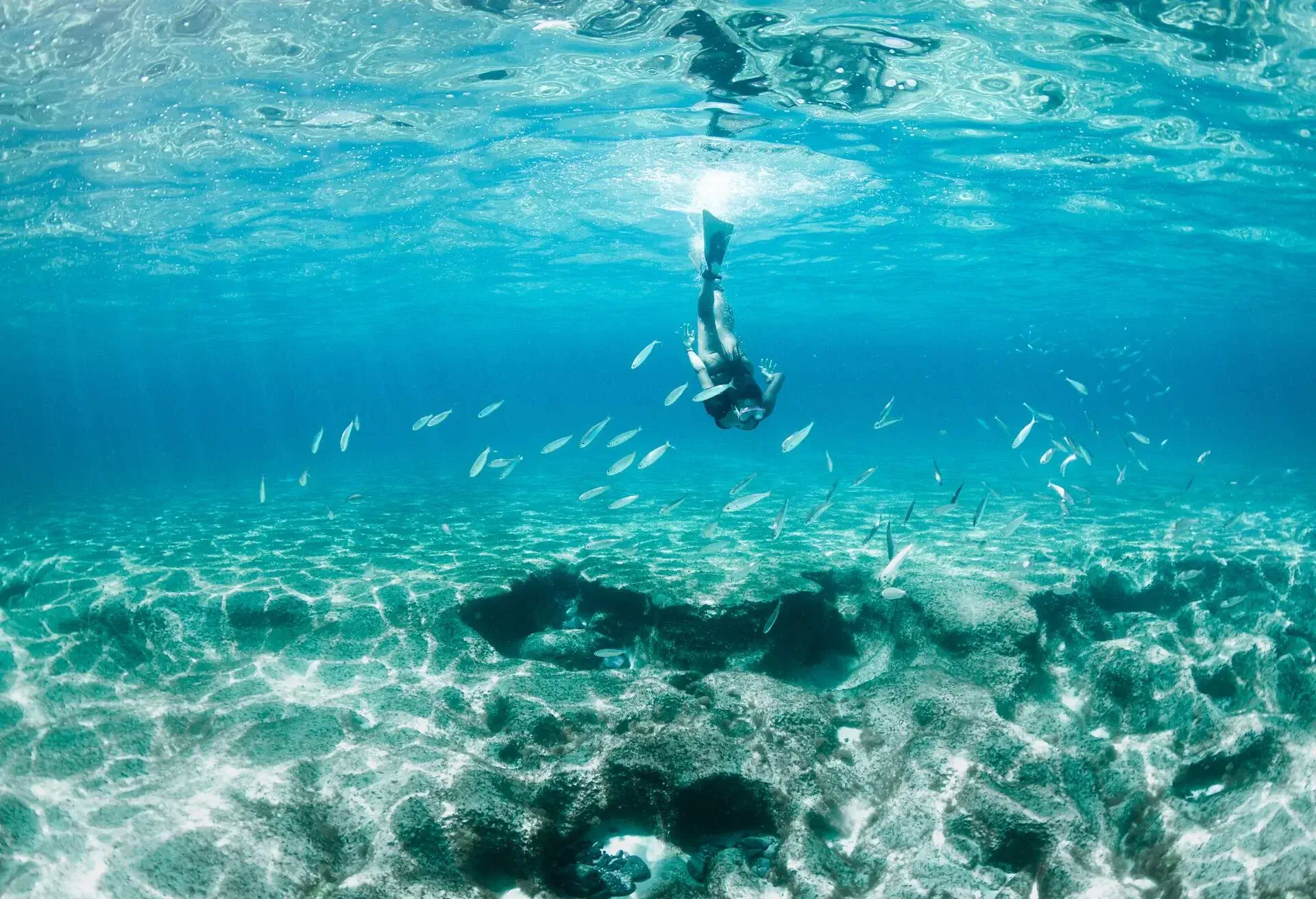 DEST_SPAIN_ARRECIFE_SWIMMING_WOMAN_SEA_GettyImages-1057594566_Universal