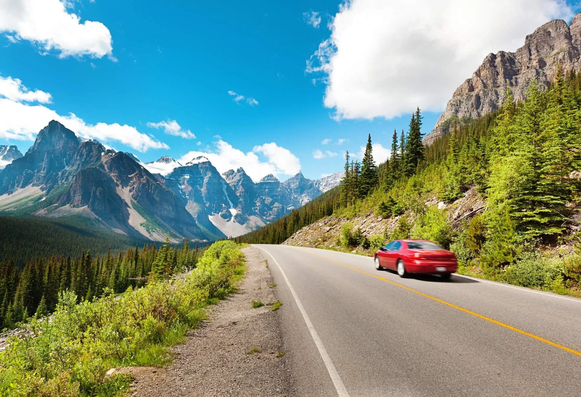 Tourist traveling in a car vacationing in the Canadian Rockies Banff National Park in Canada.